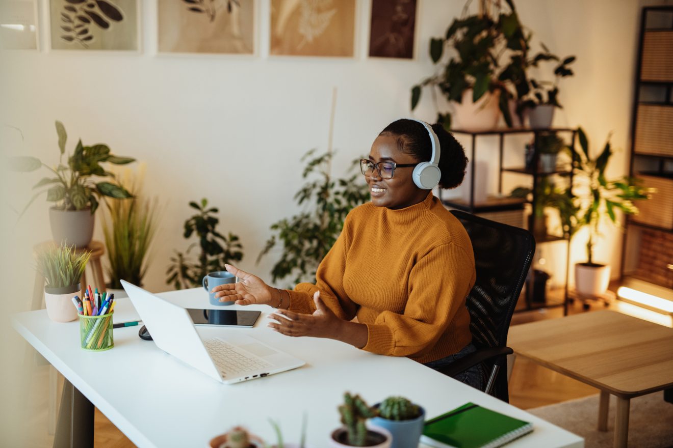A woman participates in a video call from her home